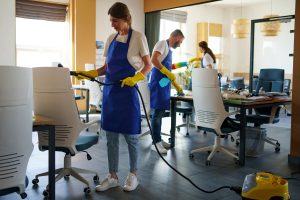 professional cleaning service person using vacuum cleaner office 300x200